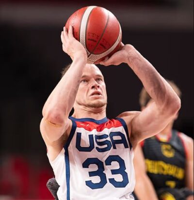 Wheelchair basketball player John Boie wearing Team USA gear shooting a free throw