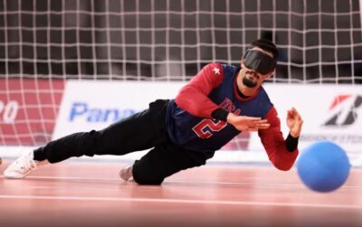 5th Paralympian Tyler Merren diving for a ball in a goalball game