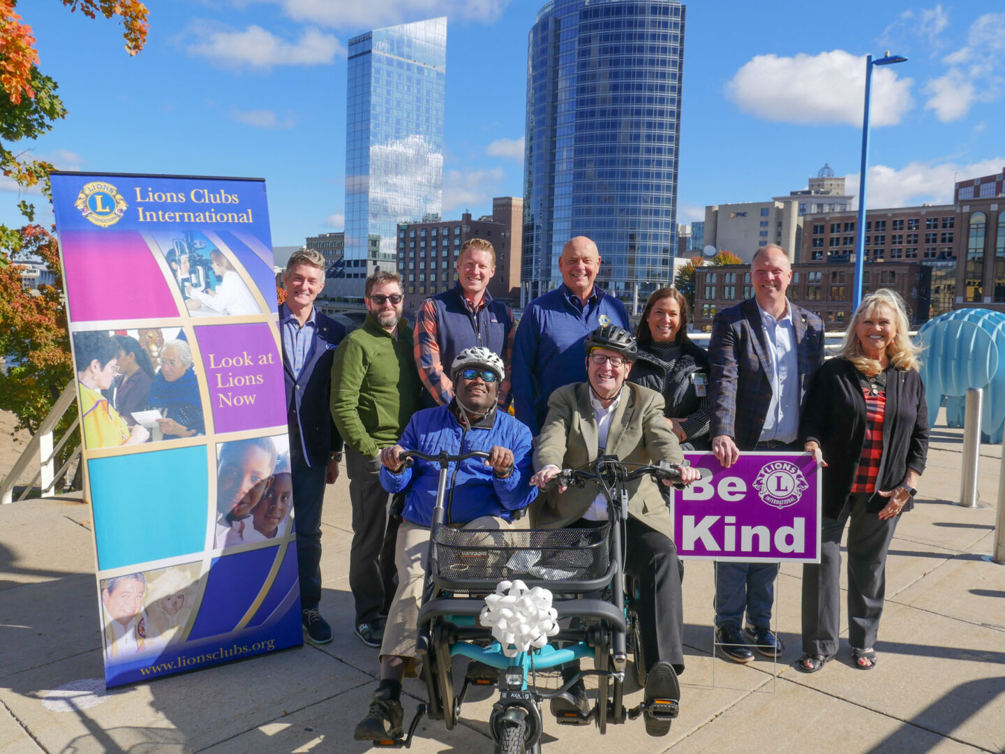 Members of ABVI and Lions Club pose for picture with new bike