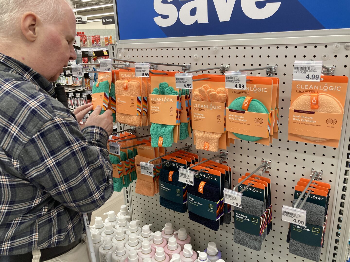 A person with low vision in a store using braille to read about products